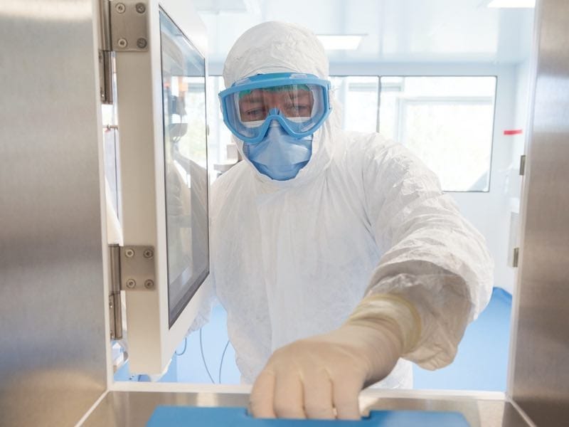 Scientist wearing a protective mask and gloves
